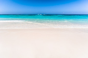 Fototapeta na wymiar Beautiful tropical beach, white sand and blue sky background with travel yacht boat
