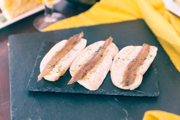 Tapas with sliced bread and fish