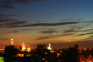 city skyline with two churches after the sunset in summer 