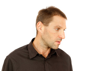 Fototapeta premium Portrait of a man deliberating in profile on white background