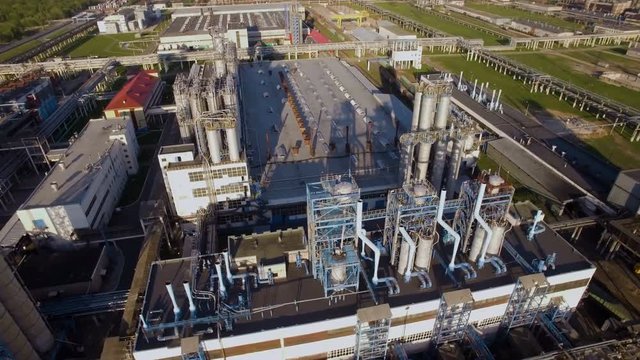 A huge oil refinery with pipes and distillation of the complex. Aerial view