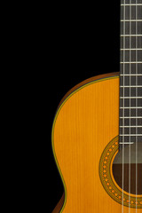 Obraz premium Fragment of classical guitar on a black background (isolate, copyspace)