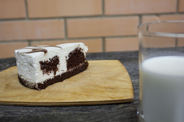 cake and milk on a wooden table