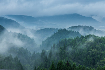 Beautiful mountain range covered with fog and rain in Yufuin, Oita, Japan