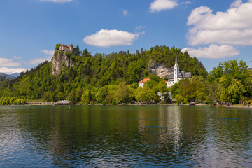 Fototapeta na wymiar View of Bled Castle on the Bled Lake and Julian Alps, Slovenia