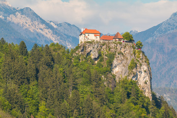 Fototapeta na wymiar View of Bled Castle on the Bled Lake and Julian Alps, Slovenia