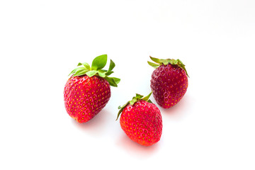 Strawberry on white background. Three fresh berries