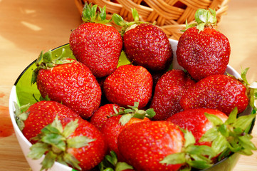 Bright fresh strawberry in a round container