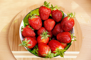 Bright fresh strawberry in a round container