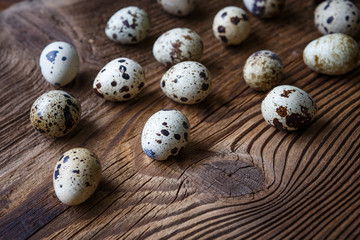Quail eggs on a wooden board