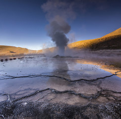geyser tatio with water surface at sunrise