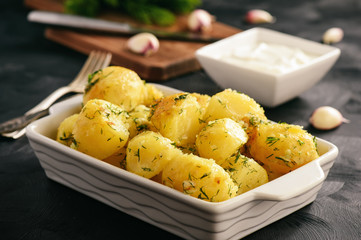 Baked new potatoes with garlic and dill.