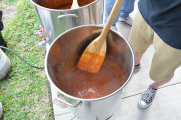 Stirring chili pots in competition