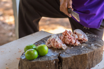 Chef cutting fish before cooking