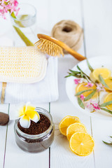Fototapeta na wymiar Spa and bathroom aromatherapy accessories with lemon fruit. coffee coconut scrub hyacinth towel