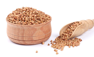 buckwheat on wooden bowl isolated on white background