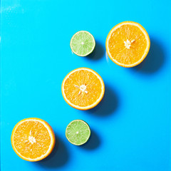 Concept of fresh fruit background of orange and lime