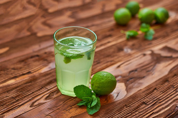 Fresh drink photo of home made limonade on wooden background