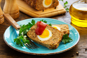 Baked meat loaf with eggs for Easter holiday.