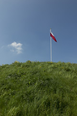 Polish national flag at the summit of liberation mound