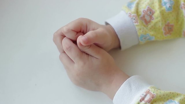 Hands of a child on a white background