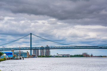 The Delaware River and Ben Franklin Bridge, seen from Penn's Landing in Philadelphia, Pennsylvania.
