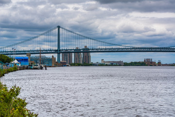 The Delaware River and Ben Franklin Bridge, seen from Penn's Landing in Philadelphia, Pennsylvania.