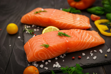 Fresh salmon fillet with aromatic herbs, spices and vegetables