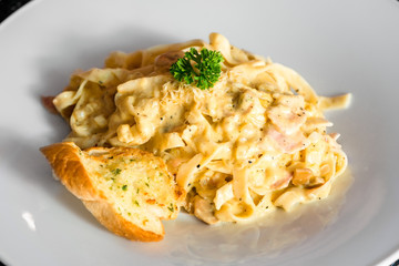 Serving of pasta carbonara national Italian dish close up