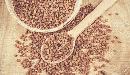 Dry buckwheat groats. Healthy food and diet concept.