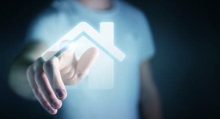 Businessman touching 3D rendering icon house with his finger