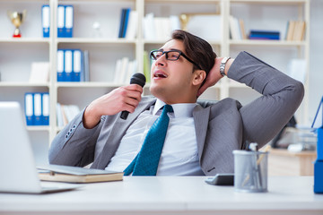 Businessman singing in the office