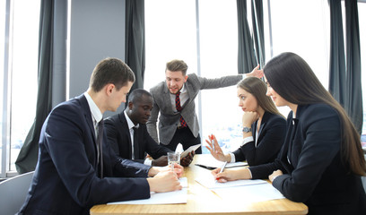 Manager yelling at his employees at the meeting. Company is in recession.