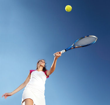 woman tennis player with racket during a match game, isolated