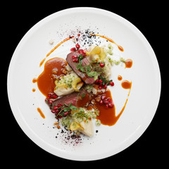 Venison fillet and potato puree isolated on black