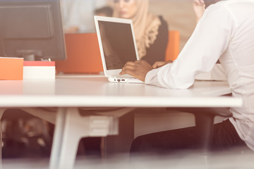 Arabic business woman wearing hijab,working in startup office.