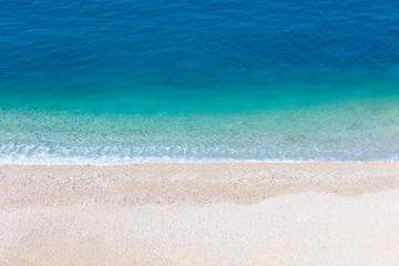 Fototapeta na wymiar Top aerial view of empty beauty beach in Italy, Europe