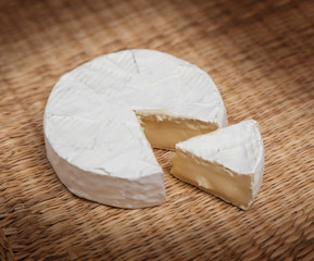 Fresh slice of Camembert cheese natural