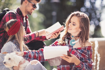 Group Of Students Chatting Together In Park
