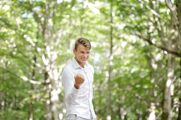 Happy young man celebrating success