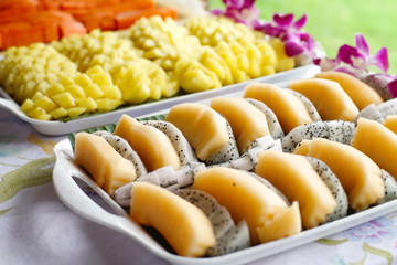 dragon fruit pineapple papaya on buffet line