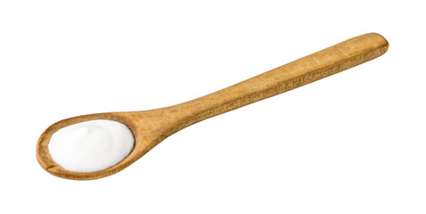 White Yogurt on Wooden Spoon Isolated on White Background