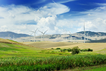 Fototapeta na wymiar Wind generator turbine and blue sky - ecology energy saving concept