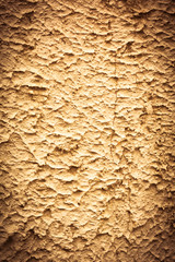 Grungy golden or vintage white background of old concrete plaster wall. Conceptual old texture banner