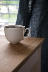 Cup of hot tea/coffee on the table