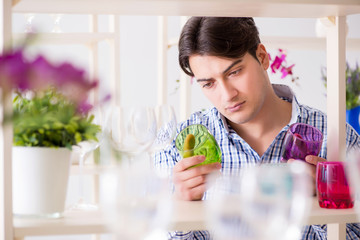 Young handsome man shopping in shop