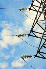 Electrical power insulator against of blue cloudy sky.