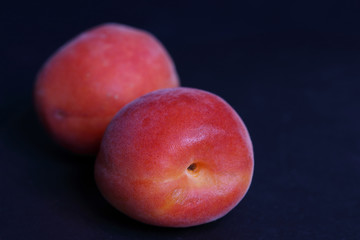 Apricot fresh on black background close up.