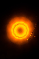 Concept of speed - Trail of fire and smoke - Vinyl record. Burning vinyl disk. Turntable vinyl record player. Retro audio equipment for disc jockey. Sound technology. Close up