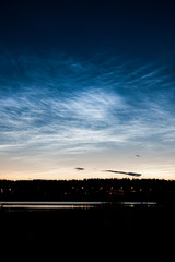 Noctilucent clouds at night sky